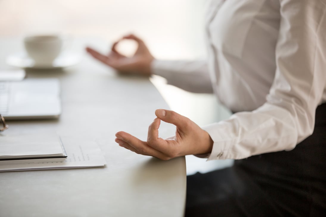 Office meditation for reducing work stress concept, female hands closeup